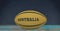 Composition of rugby ball decorated with text australia on black background