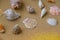 Composition seashells, pebbles, mockup on sand background. Marine still life, flat lay. Sea summer vacation travel