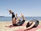 Composition of several bikram yoga poses at beach