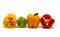 Composition of several halves of ripe sweet pepper of different colors on a light background.