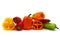 Composition of several sweet peppers and their halves of different colors on a light background.