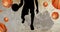 Composition of silhouette of basketball player and basketballs over basketball court