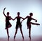 Composition from silhouettes of three young ballet