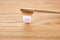 Composition with small plastic teeth and bamboo toothbrush on wooden background