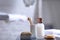 Composition with soap and toiletries on table against blurred background