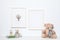 Composition with soft toys and photo frame on white. Child room interior decor