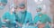 Composition of surgeons in face masks over male patient in operating theatre
