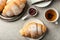 Composition with tasty croissants on light background