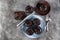 Composition with tasty cupcakes and chocolate on grey table