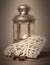 Composition with tin grey decorative lantern on wooden