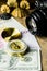 Composition of tourist compass,money,shells and fotocamera on the wooden table