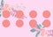 Composition of tropical plant elements with eight pink circles on pale pink background