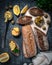 A composition of two baguettes of bran and whole grain flour. Sandwich of hummus and olives. On the wooden spacing. View from