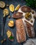 A composition of two baguettes of bran and whole grain flour. Sandwich of hummus and olives. On the wooden spacing. View from