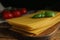 Composition with uncooked lasagna sheets on table, closeup