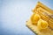 Composition of uncooked macaroni products on blue background foo