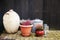 Composition vase pots with flowers and lantern on a dark wooden