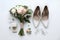 Composition with wedding high heel shoes on white background, top view