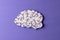 Composition of white and purple brain on purple background with copy space