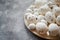 Composition of white traditional dotted Easter eggs in white ceramic plate