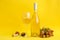 Composition wine and fruits on yellow background