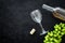 Composition with wine. Open white wine bottle, bunch of grapes, cork, wine glass on black background top view copy space