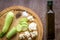 Composition on wooden background organic vegetarian foods: zucchini, cauliflower, black pepper and salt. The view from