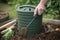 compost bin with built-in handle and rake for easy handling