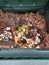 Compost bin with leaves and kitchen scraps