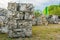 Compressed aluminium scrap in large cubes forming landfill in piles.