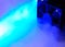 Computer air cooler in a neon blue smoke - close up photo. Background abstract picture.