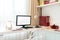 Computer display and office tools on desk in home. Desktop computer screen isolated. Modern creative workspace background.