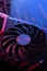 Computer game graphics card, videocard with two coolers on circuit board ,motherboard background. Close-up. With red-blue lighting