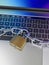 Computer keyboard locked with padlock and chain - security
