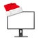 Computer monitor and Santa Claus red christmas hat