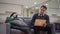 Concentrated absorbed Middle Eastern man typing on laptop keyboard as bored Caucasian woman sitting on couch. Portrait