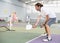 Concentrated adult pickleball player preparing to return ball