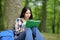 Concentrated asian woman studying in a park