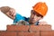 Concentrated bricklayer putting