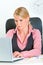 Concentrated business woman sitting at office desk