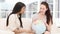 Concentrated businesswomen looking at a terrestrial globe