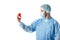 Concentrated cardiologist wearing blue uniform and holding toy heart