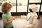 concentrated child interact with robot artificial intelligence, communication