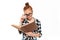 Concentrated ginger woman in eyeglasses reading book