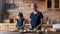 Concentrated mother recovering from cancer enjoying cooking together with daughter