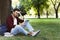 Concentrated student preparing for exam in park