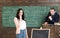 Concentrated on task. Sensual woman and teacher in classroom. Thoughtful student on examination at chalkboard. Education