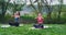 Concentrated two ladies at nature in middle of a beautiful landscape doing yoga meditation time they are concentrated