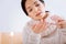 Concentrated woman being responsible while taking pills