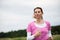 Concentrated woman running through the fields